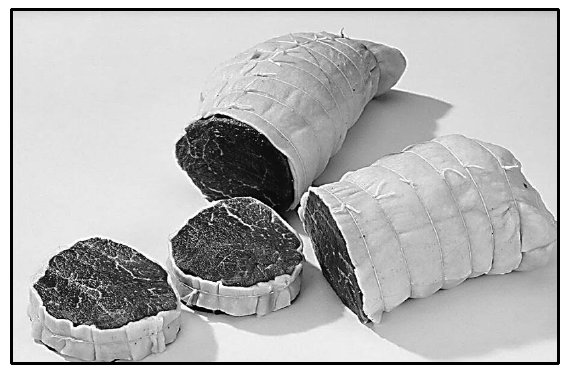 Photograph of rolled beef fillet tied with string and sliced, Hospitality Studies Grade 12 NSC November 2024 Question 1.1.4